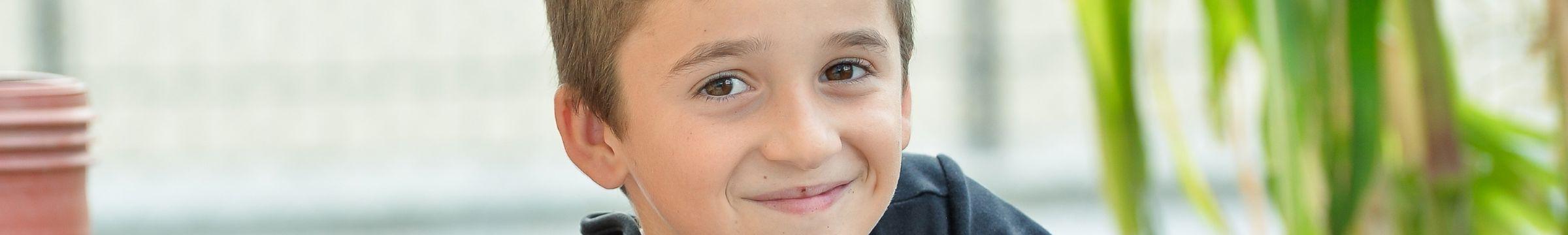 Boy sitting and smiling